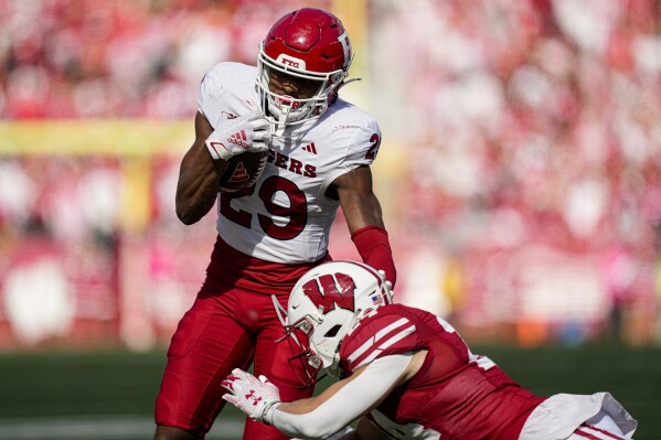 Rutgers wide receiver Ian Strong (29) runs against Wisconsin safety Hunter Wohler (24) during the second half of an NCAA college football game Saturday, Oct. 7, 2023, in Madison, Wis. (AP Photo/Andy Manis)