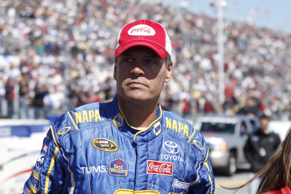 Michael Waltrip looks on at the NASCAR Daytona 500 auto race in Daytona Beach, Fla. on Feb. 14, 2010. (AP Photo/J Pat Carter, File)