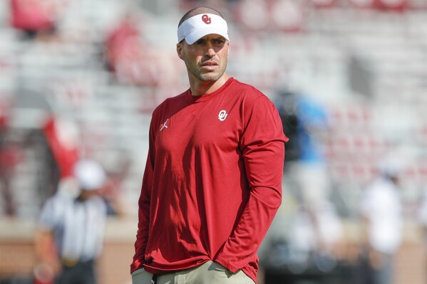 Oklahoma defensive coordinator Alex Grinch watches before the start of a NCAA college football game against Tulane on Saturday, Sept. 4, 2021, in Norman, Okla. (AP Photo/Alonzo Adams, File)