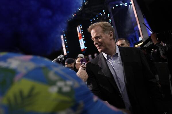 NFL Commissioner Roger Goodell meets with fans during the first round of the NFL football draft, Thursday, April 27, 2023, in Kansas City, Mo. (AP Photo/Charlie Riedel)