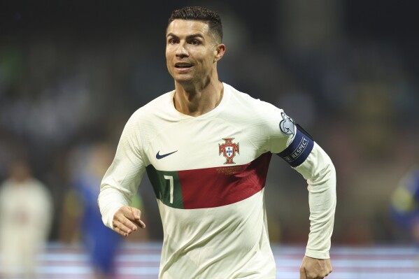 FILE - Portugal's Cristiano Ronaldo reacts after scoring during the Euro 2024 group J qualifying soccer match against Bosnia-Herzegovina at the Bilino Polje Stadium in Zenica, Bosnia and Herzegovina, Oct. 16, 2023. Ronaldo has been hit with a billion dollar class-action lawsuit over his role in promoting cryptocurrency-related “non-fungible tokens,” or NFTs, issued by the beleaguered cryptocurrency exchange Binance. The lawsuit, filed in federal court in the Southern District of Florida Monday, Nov. 27, 2023 accuses Ronaldo’s promotions of Binance of being “deceptive and unlawful.” (AP Photo/Armin Durgut, file)