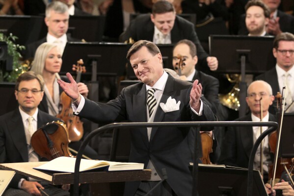 FILE - Conductor Christian Thielemann, front, gestures during the traditional New Year's concert of the Vienna Philharmonic Orchestra at the Golden Hall of Vienna's Musikverein in Vienna, Austria on Jan. 1, 2019. Thielemann has been chosen as the new general music director of Berlin's Staatsoper, months after Daniel Barenboim ended his three-decade reign, the city government said Wednesday, Sept. 27, 2023. The 64-year-old German conductor will take the job next year, Berlin state culture minister Joe Chialo announced. (AP Photo/Ronald Zak, File)