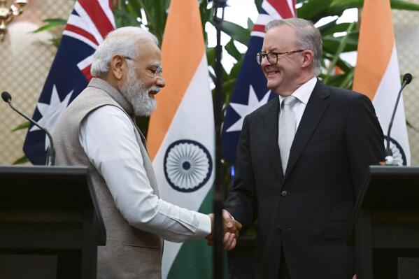 India's Prime Minister Narendra Modi, left, shakes hands with Australian Prime Minister Anthony Albanese following a joint press conference at Admiralty House in Sydney, Australia, Wednesday, May 24, 2023. Modi is the only leader of the so-called Quad nations to continue with his scheduled visit to Australia after U.S. President Joe Biden pulled out of a planned meeting of the group in Sydney to return to Washington to focus on debt limit talks. (Dean Lewins/Pool Photo via AP)