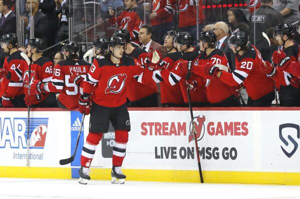 New Jersey Devils defenseman Ryan Graves (33) celebrates his goal against  the Columbus Blue Jackets with center Yegor Sharangovich (17) during the  third period of an NHL hockey game Thursday, April 6