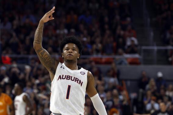 Auburn guard Wendell Green Jr. reacts after making a three pointer against Tennessee during the first half of an NCAA college basketball game Saturday, March 4, 2023, in Auburn, Ala. (AP Photo/Butch Dill)