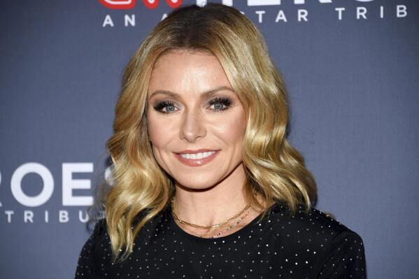 FILE - In this Dec. 9, 2018 file photo, Host Kelly Ripa attends the 12th annual CNN Heroes: An All-Star Tribute at the American Museum of Natural History in New York. Ripa is now an author.  Dey Street Books, a HarperCollins Publishers imprint, announced Tuesday, July 20, 2021, that Ripa’s essay collection “Live Wire” will come out next year.  (Photo by Evan Agostini/Invision/AP, File)