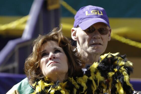 FILE - This Feb. 3, 2013, file photo shows political pundits and New Orleans Super Bowl Host Committee Co-Chairs Mary Matalin left, and James Carville in New Orleans. The couple  have replaced the New Orleans mansion that they sold for $3.3 million with a condo. Carville tells The Times-Picayune / The New Orleans Advocate that they like the fact that it's on one floor and is less than half the size of their former house. (AP Photo/Gerald Herbert, File)