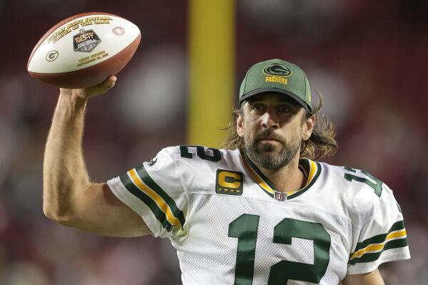 Green Bay Packers quarterback Aaron Rodgers (12) gestures as he jogs off the field after the Packers defeated the San Francisco 49ers in an NFL football game in Santa Clara, Calif., Sunday, Sept. 26, 2021. (AP Photo/Tony Avelar)