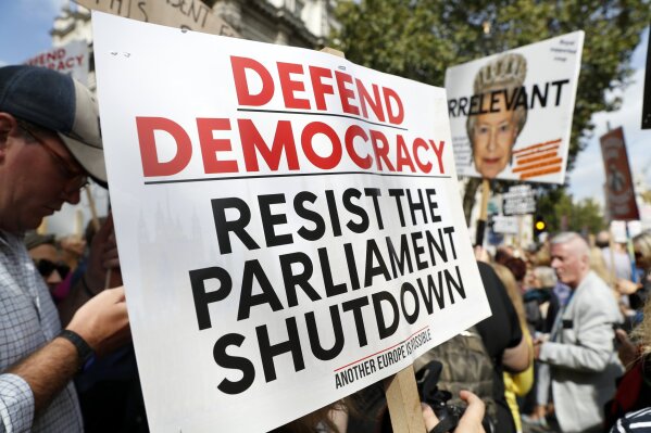 Anti Brexit protesters from 'Stop the Coup' movement demonstrate outside Downing Street in London, Saturday, Aug. 31, 2019. Political opposition to Prime Minister Boris Johnson's move to suspend Parliament is crystalizing, with protests around Britain and a petition to block the move gaining more than 1 million signatures. (AP Photo/Alastair Grant)