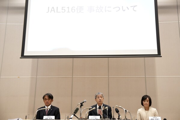 Yuji Akasaka, center, President and CEO of Japan Airlines speaks on a collision accident involving Japan Airlines Flight JL516 and Japan Coast Guard aircraft during a regular press conference in Tokyo, Wednesday, Jan. 17, 2024. Japan Airlines has named Mitsuko Tottori as its first woman president following a collision between one of its planes and a coast guard aircraft during Japanese New Year holidays that left five dead. Tottori will replace JAL president and CEO Yuji Akasaka, who will take over as chairman. (AP Photo/Eugene Hoshiko)