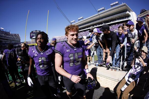 TCU quarterback Max Duggan (15) and wide receiver Blair Conwright (0) celebrate with fans following the team's 34-24 win over Texas Tech in an NCAA college football game Saturday, Nov. 5, 2022, in Fort Worth, Texas. (AP Photo/Ron Jenkins)