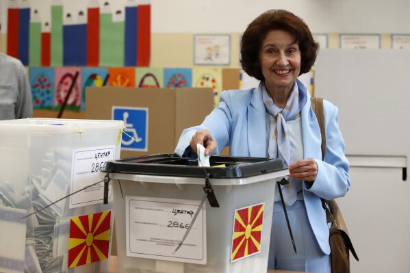 Gordana Siljanovska Davkova, presidential candidate backed by the opposition center-right VMRO-DPMNE party, casts her ballot at a polling station in Skopje, North Macedonia, on Wednesday, May 8, 2024. Voters in North Macedonia were casting ballots on Wednesday in a parliamentary election and a presidential runoff dominated by issues including the country's path toward European Union membership, corruption and the economy. (AP Photo/Boris Grdanoski)