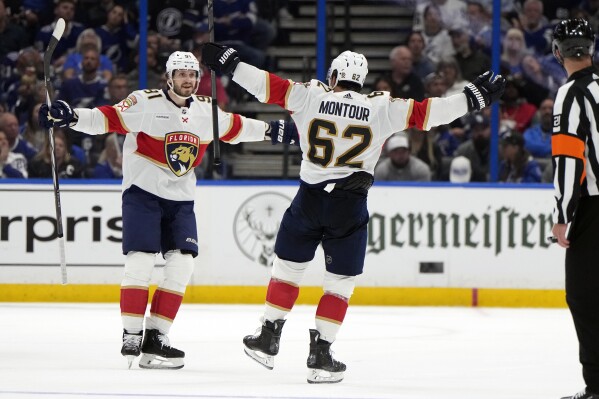 Florida Panthers defenseman Brandon Montour (62) celebrates his goal against the Tampa Bay Lightning with defenseman Oliver Ekman-Larsson (91) during the second period in Game 3 of an NHL hockey Stanley Cup first-round playoff series, Thursday, April 25, 2024, in Tampa, Fla. (AP Photo/Chris O'Meara)