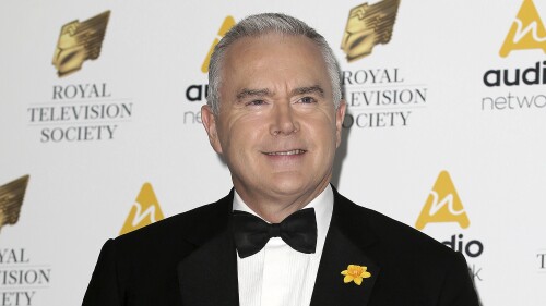 FILE - Journalist Huw Edwards poses for photographers upon arrival at the Royal Television Society Programme Awards at the Grosvenor Hotel in London, Tuesday, March 21, 2017. London police say there's no evidence that a BBC presenter who allegedly paid a teenager for sexually explicit photos committed a crime. The Metropolitan police issued the statement Wednesday, July 12, 2023 as the wife of Huw Edwards identified him as the presenter. (AP Photo/Tim Ireland, File)