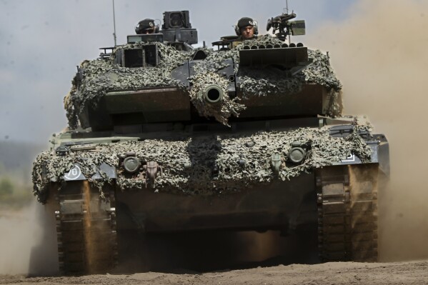 Does camo on tanks, vehicles, aircraft, etc., provide any tactical