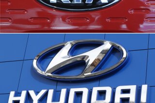 FILE- This combination of file photos shows the logo of Kia Motors during an unveiling ceremony on Dec. 13, 2017, in Seoul, South Korea, top, and Hyundai logo on the side of a showroom on April 15, 2018, in the south Denver suburb of Littleton, Colo., bottom.  Hyundai and Kia will spend $137 million on fines and safety improvements because they moved too slowly to recall over 1 million U.S. vehicles with engines that can fail. The National Highway Traffic Safety Administration announced the penalties Friday, Nov. 27, 2020.  (AP Photo, File)