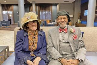 Susie Hood and her brother, Roland Irions Sr., pose on Saturday, Oct. 23, 2021, at the Courtyard Marriott in Columbus, Miss., before a meet and greet. Irions wanted to meet his 90-year-old sister for the first time for his 70th birthday. (Nicole Bowman-Layton/The Commercial Dispatch via AP)