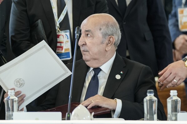 FILE - Algerian President Abdelmadjid Tebboune sits during a working session on AI, Energy, Africa and Mideast, at the G7, on June 14, 2024, in Borgo Egnazia, near Bari, southern Italy. Eleven prominent Algerian opposition figures wrote an open letter this week, denouncing “the authoritarian climate” surrounding the country’s upcoming presidential election and calling for a broad democratic transition. Under the rule of military-backed President Abdelmadjid Tebboune, freedom of expression has witnessed a rollback, experts say, with journalists and opposition members facing prison time and critical media outlets losing state advertising funding they have relied on to stay afloat.(ĢӰԺ Photo/Alex Brandon)