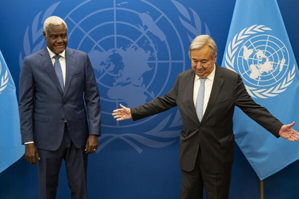 FILE - Chairperson of the African Union Commission Moussa Faki Mahamat, left, meets with United Nations Secretary-General Antonio Guterres at U.N. headquarters on Sept. 18, 2022. Mahamat in a statement Sunday, Oct. 16, 2022 expressed "grave concern" over the fighting in Ethiopia's northern Tigray region and called for an "immediate, unconditional ceasefire and the resumption of humanitarian services", echoing similar words in a statement citing Guterres issued late Saturday by a U.N. spokesman. (AP Photo/Craig Ruttle, Pool, File)