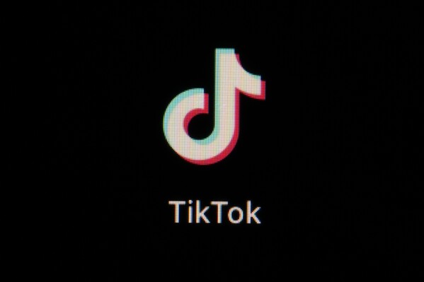 FILE - The icon for the video sharing TikTok app is seen on a smartphone, Tuesday, Feb. 28, 2023, in Marple Township, Pa. TikTok is killing off an in-app feature that was a close copy of the social media platform BeReal. TikTok said in a statement on Tuesday, June 27, that a notification was sent to users letting them know the feature would be discontinued. It said users could still access previous posts they made with TikTok Now. (AP Photo/Matt Slocum, File)