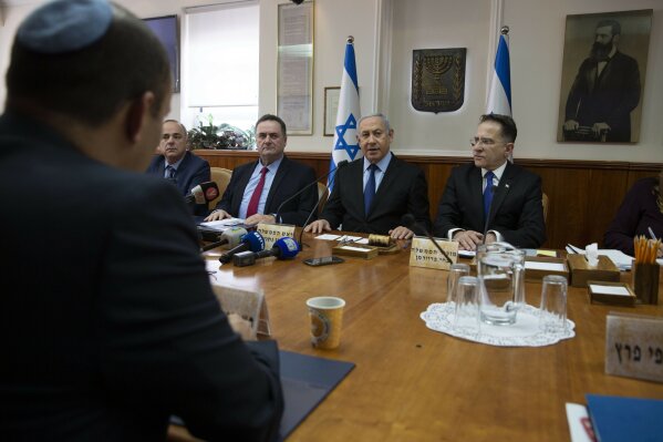 Israeli Prime Minister Benjamin Netanyahu heads the weekly cabinet meeting at the Prime Minister's office in Jerusalem, Sunday, Nov. 24, 2019. (AP Photo/Sebastian Scheiner, Pool)