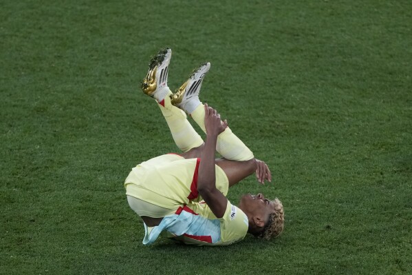 Spain's Lamine Yamal falls during the Nations League final soccer match between Portugal and Spain at the Allianz Arena in Munich, Germany, Sunday, June 8, 2025. (AP Photo/Michael Probst)