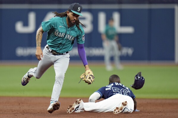 Florida Marlins infielder Luis Castillo makes the tag for an out