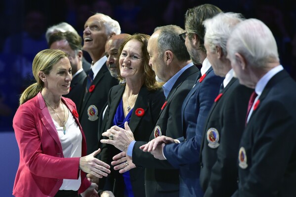 FILE - Hockey Hall of Fame inductee Jayna Hefford shakes hands with people associated with the hall before a hockey game between the Toronto Maple Leafs and the New Jersey Devils in Toronto, Nov. 9, 2018. Organizers announced plans Friday, June 30, 2023, to launch a new women’s professional hockey league in January that they hope will provide a stable, economically sustainable home for the sport's top players for years to come. PHF Commissioner Reagan Carey and PWHPA chief Jayna Hefford are expected to have leadership roles. (Frank Gunn/The Canadian Press via AP, File)