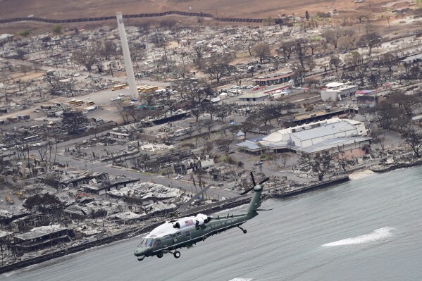 President Joe Biden and first lady Jill Biden take an aerial tour on Marine One over areas devastated by the Maui wildfires, Aug. 21, 2023, in Lahaina, Hawaii. (AP Photo/Evan Vucci)