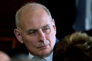 
              In this April 3, 2018 photo, President Donald Trump's Chief of Staff John Kelly attends a news conference in the East Room of the White House in Washington.  Kelly, once empowered to bring order to a turbulent West Wing, is receding from view, his clout diminished, his word less trusted by staff and his guidance less tolerated by an increasingly go-it-alone-president. Emboldened in his job, President Donald Trump has rebelled against Kelly’s restrictions and mused about doing away with the chief of staff post entirely, leaving White House staffers and Trump allies to believe that Kelly is working on borrowed time.  (AP Photo/Andrew Harnik)
            