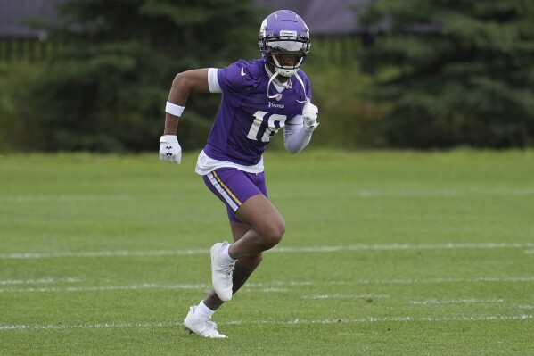 Minnesota Vikings wide receiver Justin Jefferson (18) takes part in drills during NFL football practice at the team's minicamp in Eagan, Minn., Wednesday, June 5, 2024. (AP Photo/Abbie Parr)