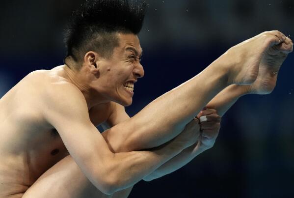 Ken Terauchi of Japan competes in men's diving 3m springboard final at the Tokyo Aquatics Centre at the 2020 Summer Olympics, Tuesday, Aug. 3, 2021, in Tokyo, Japan. (AP Photo/Dmitri Lovetsky)