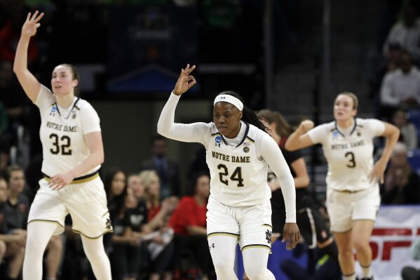 
              Notre Dame's Arike Ogunbowale (24) reacts after shooting a 3-point shot during the first half of a regional championship game against Stanford in the NCAA women's college basketball tournament, Monday, April 1, 2019, in Chicago. (AP Photo/Nam Y. Huh)
            