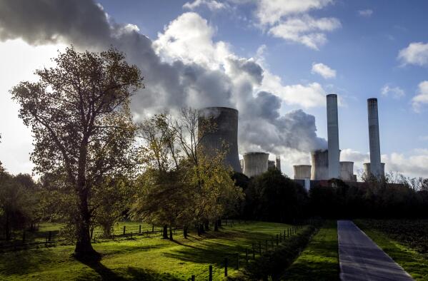FILE - Steam rises from the coal-fired power plant Niederaussem, Germany, on Nov. 2, 2022. Researchers say efforts to remove carbon dioxide from the atmosphere aren't being scaled up fast enough and can’t be relied on to meet crucial climate goals. A report published Thursday by scientists in Europe and the United States found that new methods of CO2 removal currently account for only 0.1% of the 2 billion metric tons sucked from the atmosphere each year. (AP Photo/Michael Probst, File)