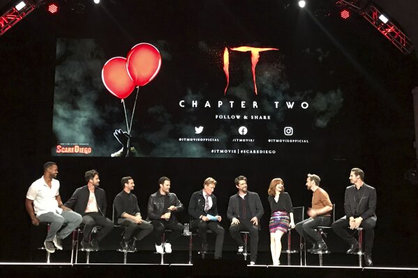 Casts of "It: Chapter Two" sit at a Comic-Con event Wednesday night, July 17, 2019 at the Spreckels Theater in San Diego, Calif. A theater of fans got a sneak peek at the latest promo for the horror sequel at the Comic-Con event before it's released to the world Thursday morning. They are, from left to right, Isaiah Mustafa, Andy Bean, James Ransone, Bill Hader, Conan O'Brien, Andy Muschietti, Jessica Chastain, James McAvoy, Jay Ryan. (AP Photo/Lindsey D. Bahr)