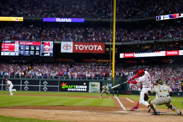 Philadelphia Phillies' Bryce Harper hits an RBI double during the fifth inning in Game 4 of the baseball NL Championship Series between the San Diego Padres and the Phillies on Saturday, Oct. 22, 2022, in Philadelphia.(AP Photo/Matt Slocum)