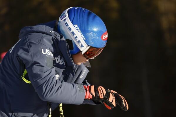 United States' Mikaela Shiffrin concentrates ahead of an alpine ski, women's World Cup downhill race, in Cortina d'Ampezzo, Italy, Friday, Jan. 26, 2024. Shiffrin crashed into the safety nets after losing control landing a jump during a World Cup downhill on Friday. (AP Photo/Gabriele Facciotti)
