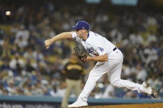 Los Angeles Dodgers relief pitcher Evan Phillips (59) throws during the eighth inning of a baseball game against the San Diego Padres Thursday, Sept. 30, 2021, in Los Angeles. (AP Photo/Ashley Landis)