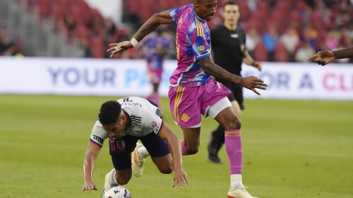 Toronto FC's Mark-Anthony Kaye, right, works against St. Louis City's Nicholas Gioacchini during the first half of an MLS soccer match Saturday, July 8, 2023, in Toronto. (Chris Young/The Canadian Press via AP)