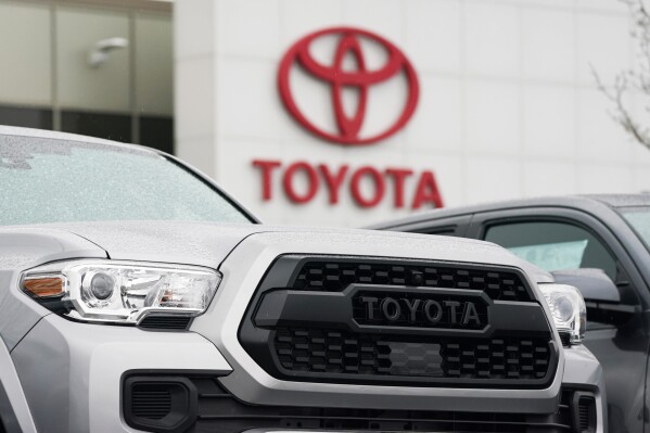 A logo of Toyota Motor Corp. is seen at its dealership in Lakewood, Colo., on March 21, 2021. Toyota says it plans to make an all solid-state battery as part of ambitious plans for battery electric vehicles, amid mounting criticism Japan’s top automaker needs to do more to fight climate change. (AP Photo/David Zalubowski)