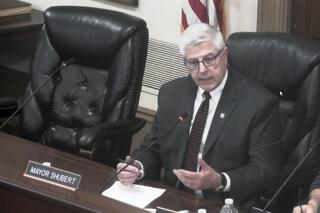 This image from video shows Hudson (Ohio) Mayor Craig Shubert in a City Council meeting, Feb. 8, 2022 in Hudson, Ohio. Shubert, who had suggested allowing ice fishing shanties on a lake could lead to prostitution, has resigned after a week of being mocked and drawing national attention to the city. Hudson Mayor Shubert said he was stepping down Monday, Feb. 14, 2022. (AP Photo)