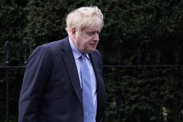 FILE - Boris Johnson leaves his house in London, on March 22, 2023. Boris Johnson established an independent inquiry while he was U.K. prime minister into the government’s handling of the COVID-19 pandemic. Now the inquiry wants to see what Johnson wrote to other U.K. officials as the outbreak raged. But the government is fighting a demand to hand over the material. (AP Photo/Alberto Pezzali)