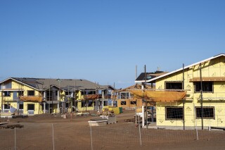 FILE - Kaiaulu o Kukuia, a 200-unit affordable housing complex under construction that was not seriously affected by August's wildfire, is pictured on Oct. 3, 2023, in Lahaina, Hawaii. A University of Hawaii report published Monday, March 4, 2024, found regulatory costs account for more than half of the price of a new condominium in Hawaii, a place where high housing costs are fueling an exodus of local-born residents searching for cheaper places to live. (AP Photo/Mengshin Lin, File)