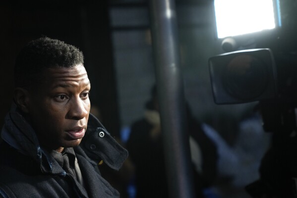 FILE - Jonathan Majors leaves the Manhattan criminal courthouse in New York, Dec. 18, 2023. In his first interview since his assault and harassment conviction last month, Majors says he was shocked by the New York jury’s verdict, Monday, Jan. 8, 2024. (AP Photo/Seth Wenig, file)