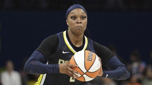 FILE - Dallas Wings guard Odyssey Sims works against the Phoenix Mercury during a WNBA basketball game, Wednesday, June 7, 2023, in Arlington, Texas. Seven years ago, Odyssey Sims was the hometown girl and co-star of the Dallas Wings, helping introduce the WNBA to a new Texas market. Five teams and the birth of a child later, Sims is on her second contract of the season in a return to the Wings, mature enough to call the younger version of herself a bad teammate while knowing she has to be a good one for the current faces of the franchise, Arike Ogunbowale and Satou Sabally. (AP Photo/Tony Gutierrez, File)