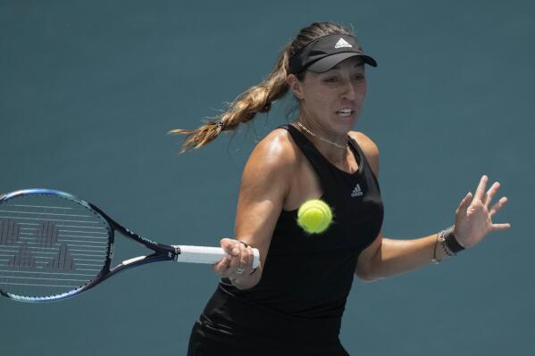 Jessica Pegula of the U.S. returns a ball to Paula Badosa of Spain in their quarterfinal match at the Miami Open tennis tournament, Wednesday, March 30, 2022, in Miami Gardens, Fla. (AP Photo/Rebecca Blackwell)
