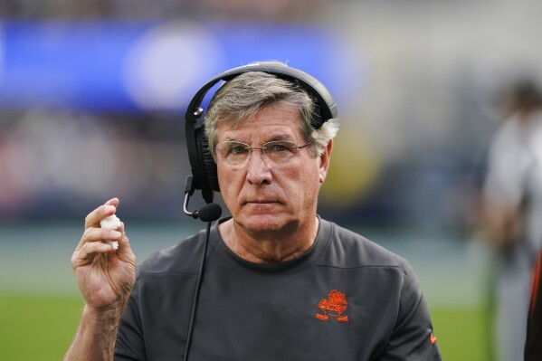 FILE -Cleveland Browns offensive line coach Bill Callahan stands on the sidelines during the first half of an NFL football game against the Los Angeles Rams Sunday, Dec. 3, 2023, in Inglewood, Calif. The Cleveland Browns have granted Tennessee permission to speak with offensive line coach Bill Callahan about joining his son Brian's staff with the Titans, a person familiar with the negotiations told The Associated Press on Thursday night, Feb. 1, 2024. (AP Photo/Ryan Sun, File)