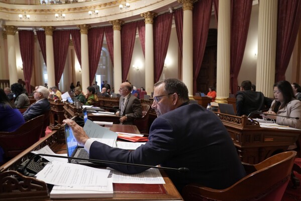 State Sen. Brian Dahle, R-Bieber, works at his desk during the Senate session at the Capitol in Sacramento, Calif., Tuesday, Sept. 12, 2023. Lawmakers are voting on hundreds of bills before the legislative session concludes for the year on Thursday. (AP Photo/Rich Pedroncelli)