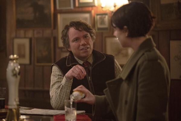 This image released by A24 shows Rory Kinnear, left, and Jessie Buckley in a scene from "Men." (Kevin Baker/A24 via AP)