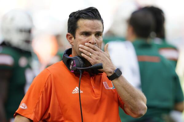 FILE - Miami head coach Manny Diaz looks on as officials review a play during the first half of an NCAA college football game against Georgia Tech, Saturday, Nov. 6, 2021, in Miami Gardens, Fla. Manny Diaz was fired as Miami’s football coach Monday, Dec. 6, 2021, after a 7-5 regular season and with the school in deep negotiations to bring Oregon coach Mario Cristobal back to his alma mater to take over. (AP Photo/Wilfredo Lee, File)